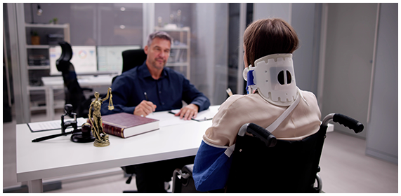 SSDI/SSI consultation with attorney and disabled client in wheelchair - California Disability Law Office