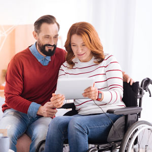 Couple reviewing disability benefits on a tablet – SSA assistance in Los Angeles, CA.
