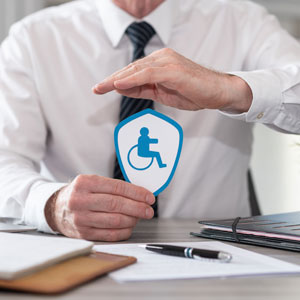 Man holding disability sign – Understanding Social Security Disability Insurance (SSDI).