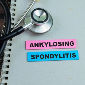 A stethoscope next to blocks spelling out 