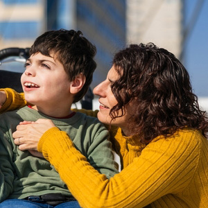 A mother embracing her young child to represent disability benefits support.