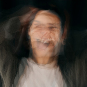 A joyful woman representing positive outcomes in mental health disability cases.